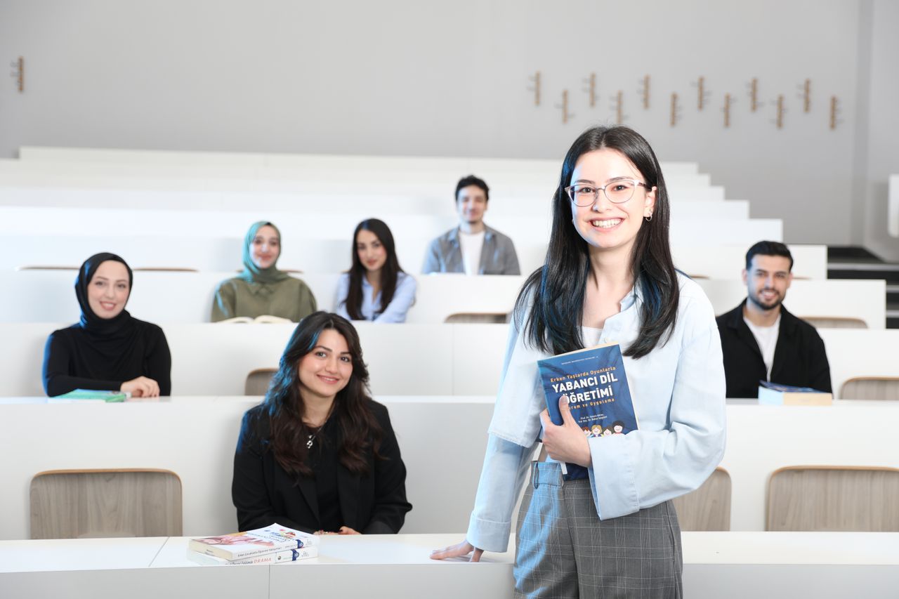 Group of diverse university students in a bright lecture hall, studying language education.